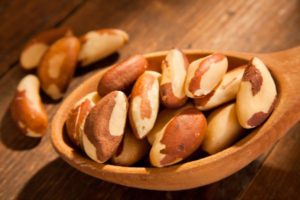Brazil nuts in a hand made wooden spoon